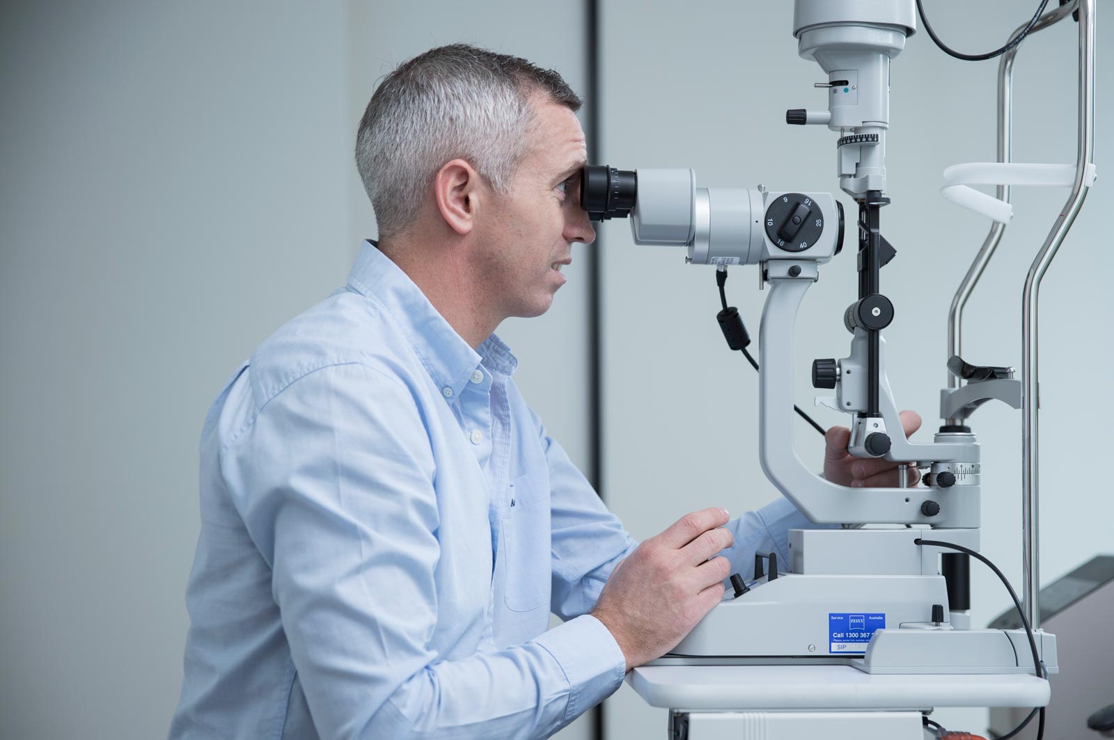 Dr-richard-barry-examining-patients-eyes Dr Richard Barry examining patients eyes